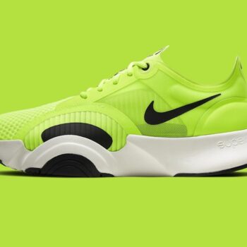 green and black nike athletic shoe