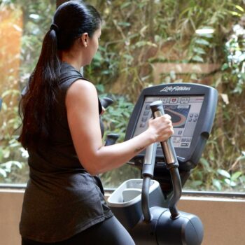 a woman using a weight machine